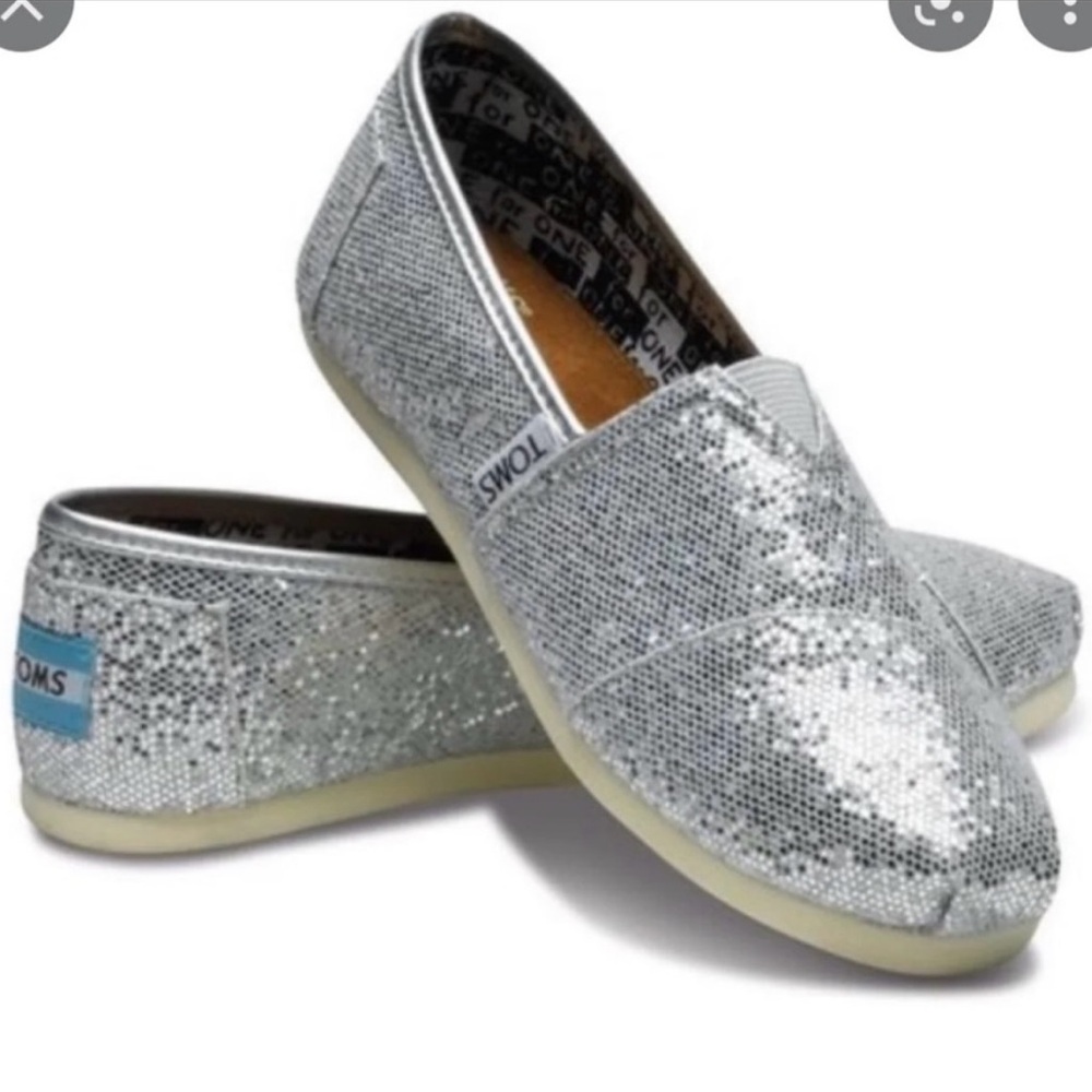 Lightly used TOMS Woman 9.5 Shimmering Silver Slippers